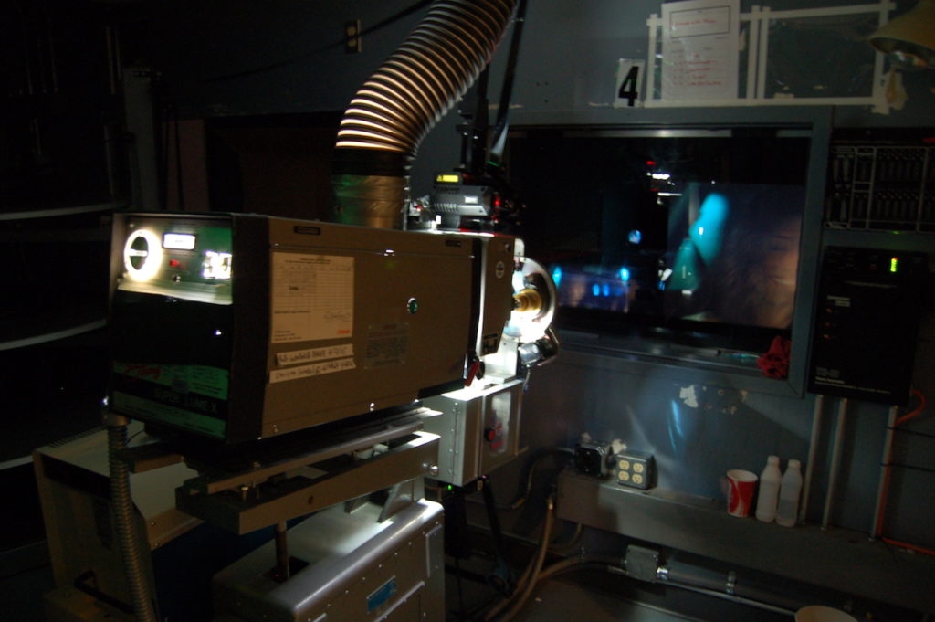 photo of projector in project room of an independent theater