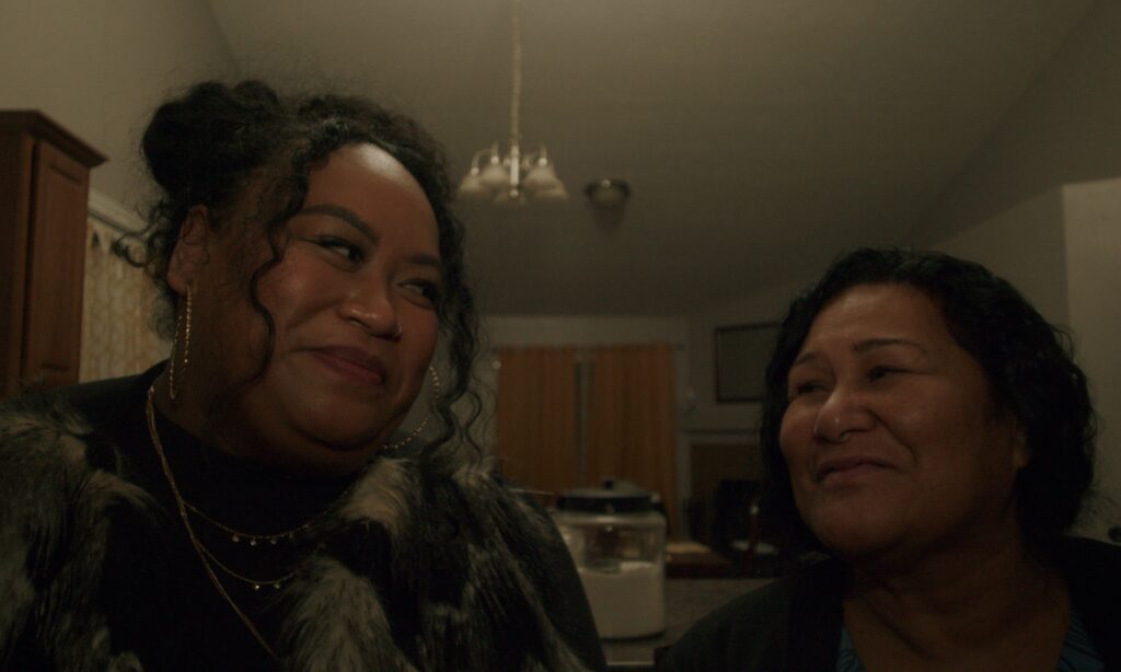 A still from a film showing two Pacific Islander women